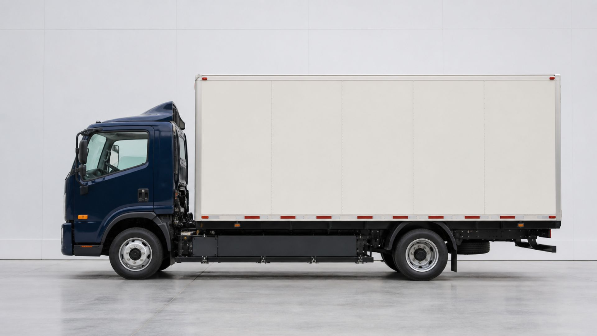 Medium-duty electric delivery truck shown in an exact side profile
