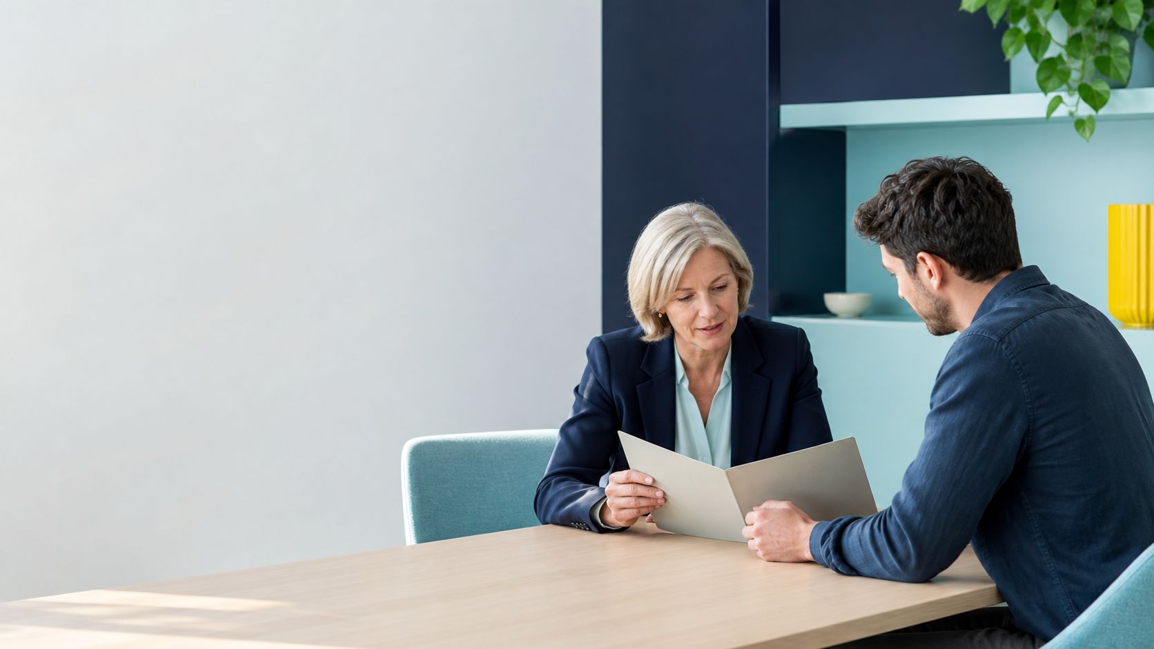 Legal adviser reviewing a document folder with a business owner