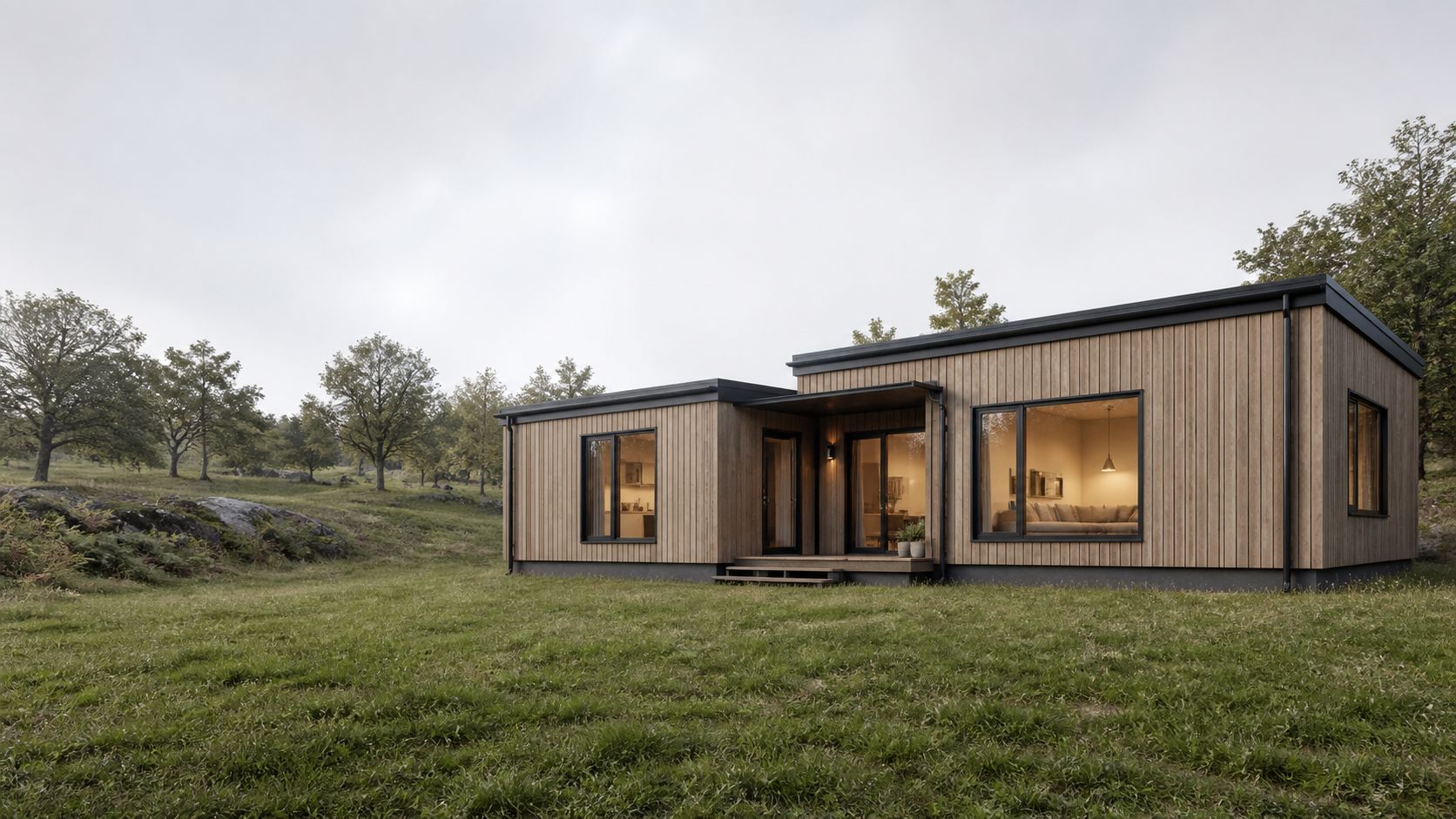 Compact cedar-clad modular home formed from two simple rectangular volumes on a rural site