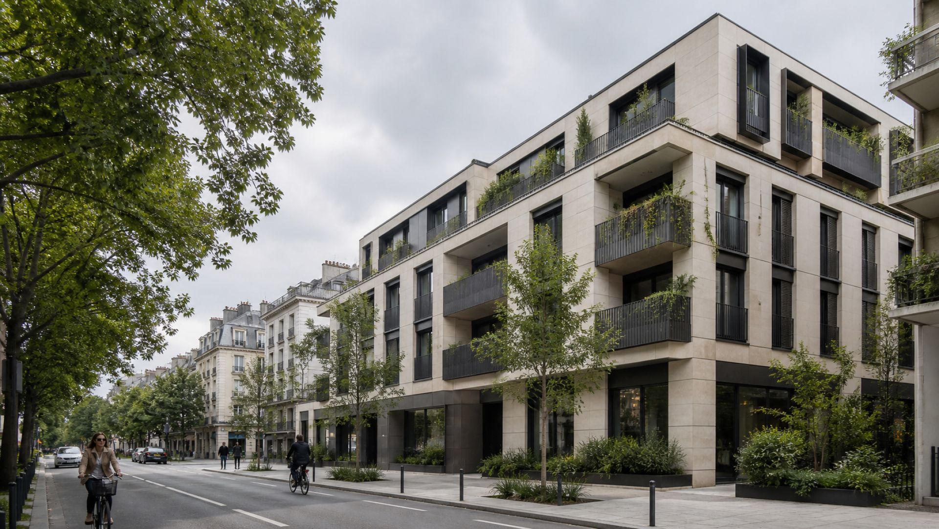Contemporary stone apartment building with planted balconies on a tree-lined urban street